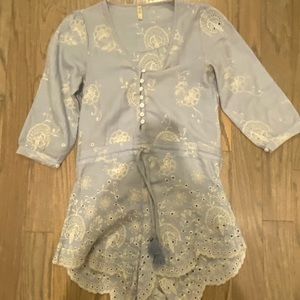 Embroidered blue and white Spell romper. See photos for imperfections.